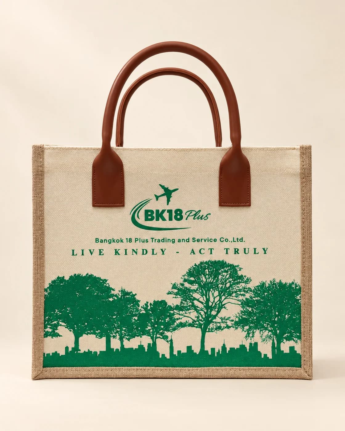 Túi canvas viền đay quai da nâu in logo BK18 Plus và hình cây xanh