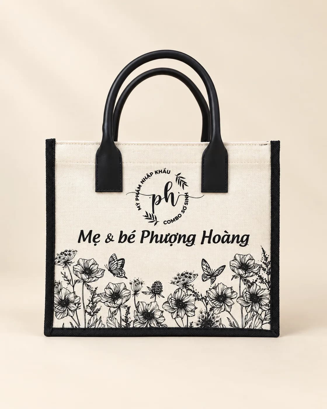 Túi canvas kem viền đen quai đen in logo Mẹ & bé Phượng Hoàng